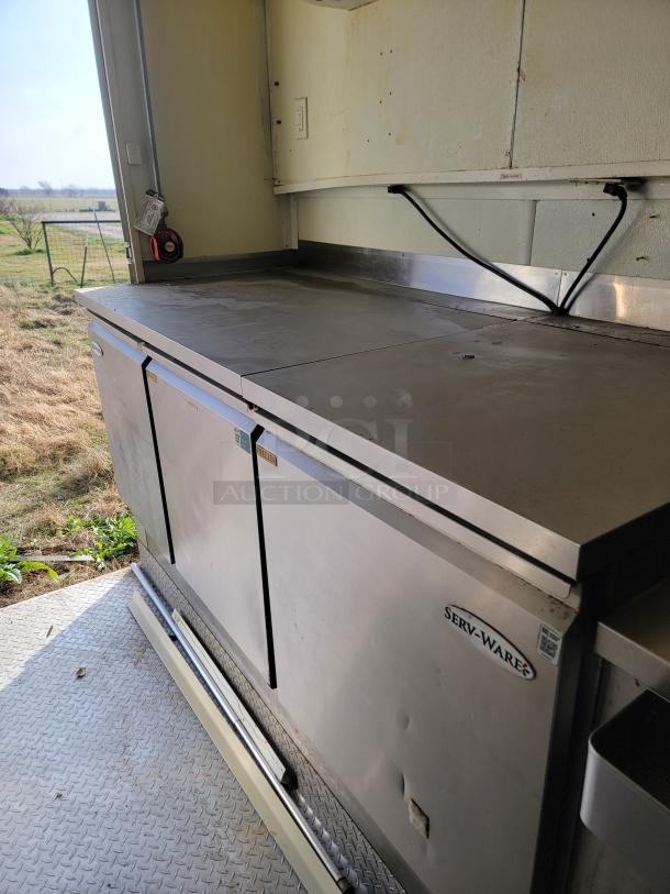 2019 Diamond Cargo mobile kitchen with Serv-Ware setup, needing cleaning and minor exterior repairs.