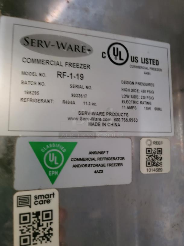 Label for Serv-Ware RF-1-19 commercial freezer showing model, serial number, design pressures, and UL certification.