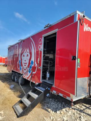2022 Rock Solid Cargo 28' Wendy's mobile kitchen trailer with triple-axle and 120/208V system. Features commercial-grade equipment.