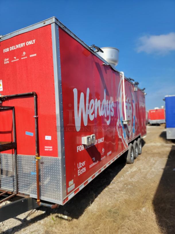 2022 Rock Solid Cargo 28' Wendy's mobile ghost kitchen trailer, red, triple-axle, delivery-focused, branding for Uber Eats and others.