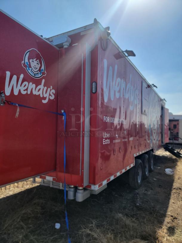 2022 Rock Solid Cargo 28' Wendy’s Mobile Ghost Kitchen trailer, red exterior, triple-axle, commercial-grade setup.
