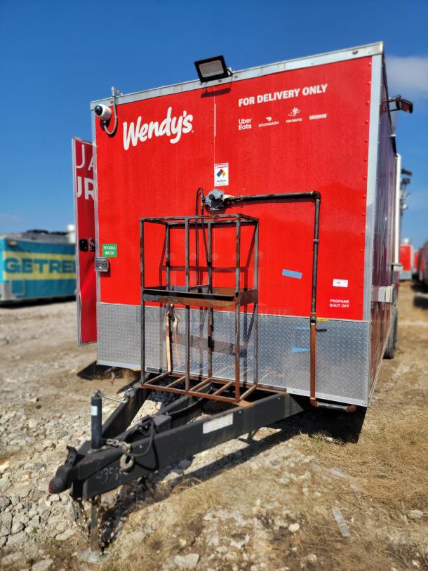 28' Wendy’s 2022 Rock Solid Cargo mobile kitchen trailer, red exterior, "For Delivery Only" branding, high-capacity setup.