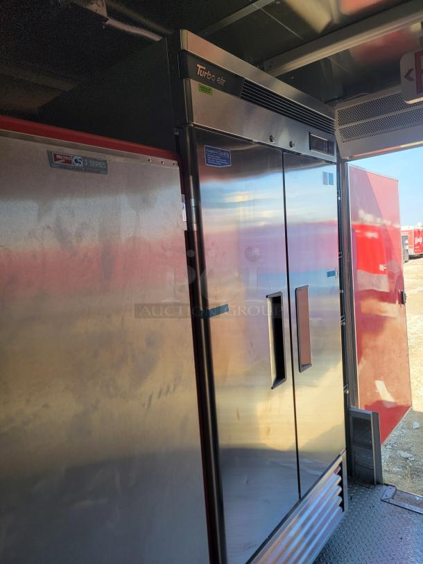 2022 Rock Solid Cargo 28' mobile kitchen interior, featuring Turbo Air fridge and Metro C5 3 Series insulated cabinet.