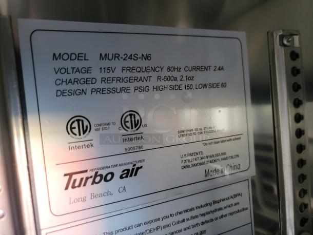 Label on refrigerator indicates model MUR-24S-N6 by Turbo Air. Voltage 115V, frequency 60Hz, refrigerant R-600a. Made in China.