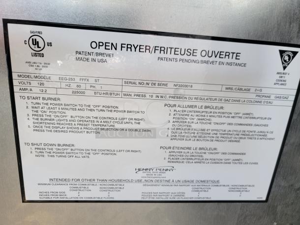 Instruction label for an open fryer, model EEG-253 FFFX ST, showing start-up and shutdown procedures.