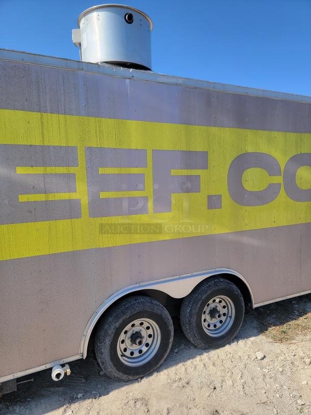 2019 Peach Cargo 24' mobile kitchen side view with dual axles, yellow logo, and roof vent; ideal for food business.