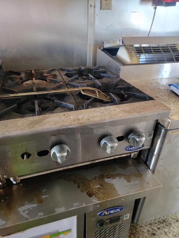 2019 Peach Cargo 24' mobile kitchen with cooktop and refrigeration unit. Features heavy-duty, stainless steel appliances.