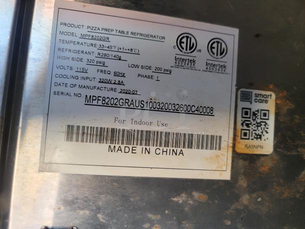 Label on a pizza prep table refrigerator, model MPF8202GR. Indicates temperature 33-45°F, made in 2020, China. Serial: MPF8202GRAUS100320032600C40008.