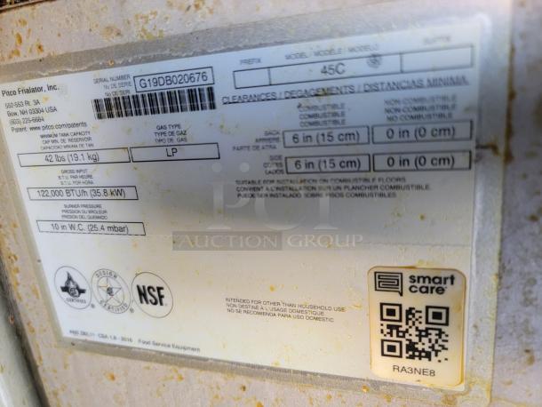 Label on Peach Cargo mobile kitchen showing specs: LP gas, 122,000 BTU/hr, NSF certified, model 45C.