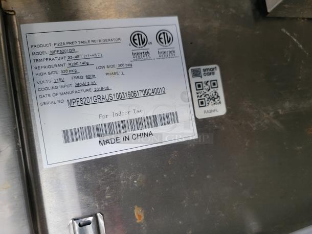 Label on a pizza prep table refrigerator, Model MPF8201GR. Details: temp 33-45°F, refrigerant R290/140g, volts 115V, made in 2019, China.