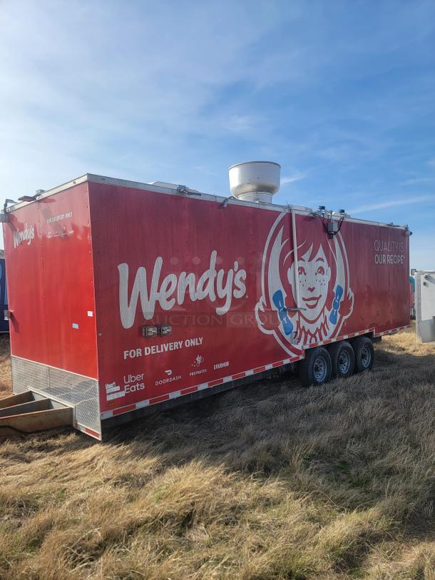 2021 Titanium Cargo 28' Triple Axle Mobile Kitchen with Wendy's branding, commercial equipment, and security features.