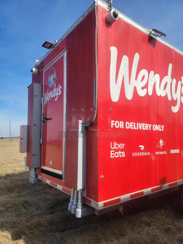2021 Titanium Cargo 28' Triple Axle Mobile Kitchen with Wendy's branding, featuring exterior security cameras and delivery service logos.