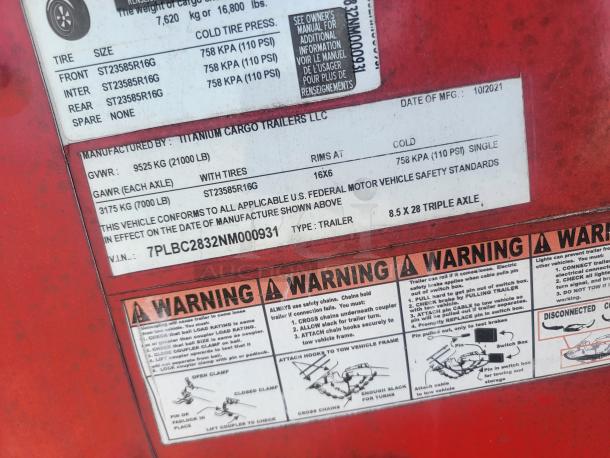Label detail of 2021 Titanium Cargo 28' Triple Axle Mobile Kitchen trailer, VIN: 7PLBC2832NM000931, showing specs and warnings.