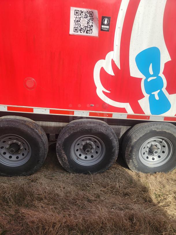 28’ Titanium Cargo Triple Axle Mobile Kitchen, red exterior, QR code and warning sticker visible.