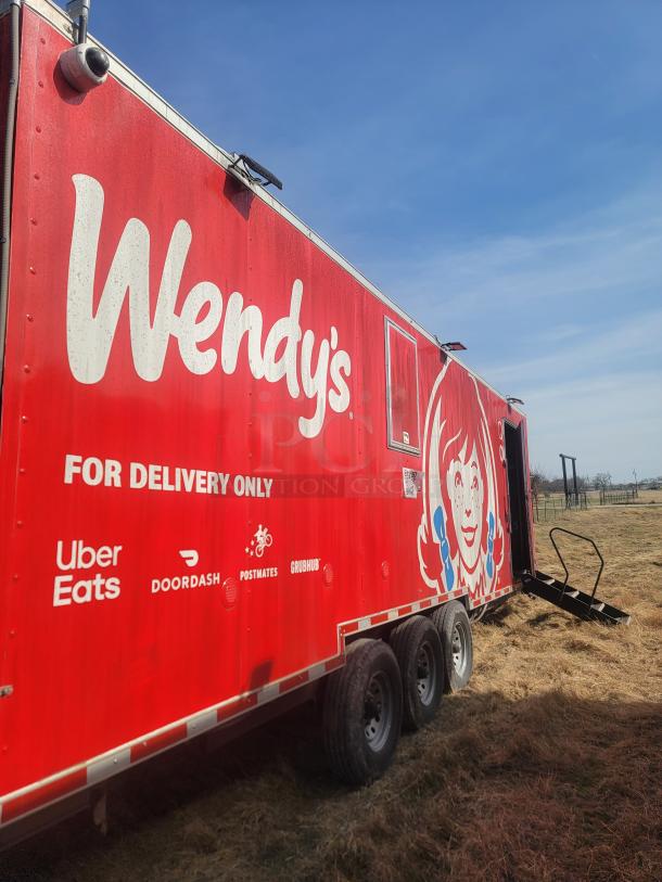 2021 Titanium Cargo 28' Triple Axle Mobile Kitchen with Wendy's branding, external security cameras, and delivery service logos.