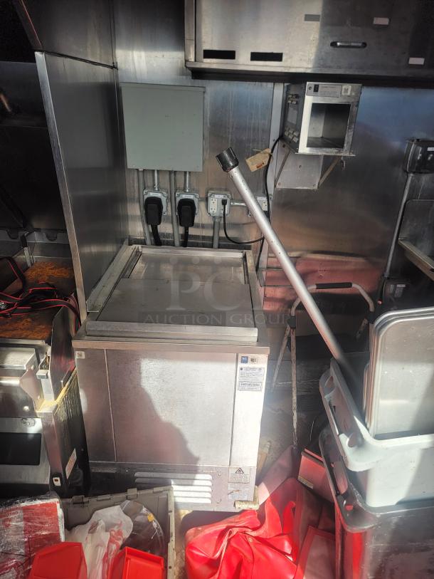 2021 Titanium Cargo 28' Triple Axle Mobile Kitchen with commercial grills, fryers, ovens, and 3-compartment sink.