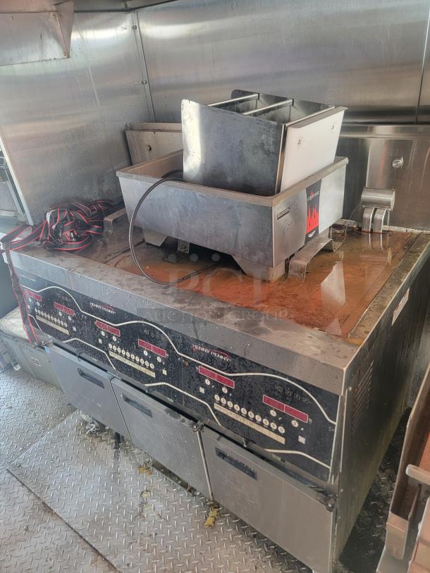 2021 Titanium Cargo 28' Mobile Kitchen interior featuring Henny Penny fryers and stainless steel equipment; triple axle.