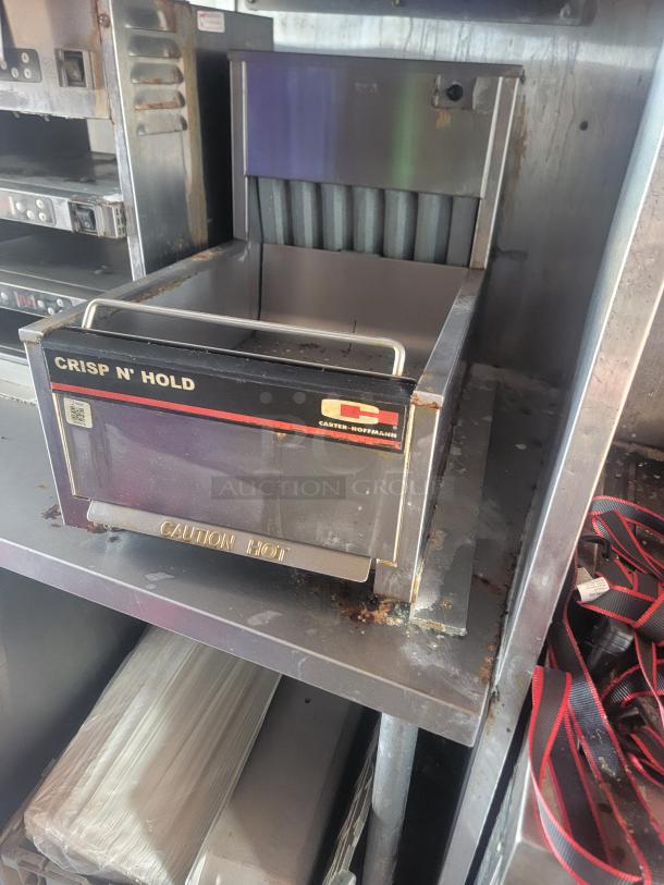Carter-Hoffmann Crisp N' Hold warmer inside 28' Titanium Cargo Mobile Kitchen. Shows slight wear, "Caution Hot" marked.