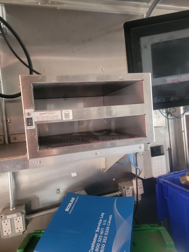 2021 Titanium Cargo 28' Mobile Kitchen interior with Henny Penny equipment, electrical panels, and visible EcoLab log.