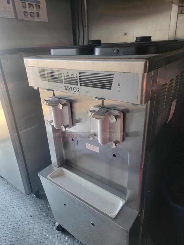 Taylor ice cream machine inside 2021 Titanium Cargo 28' mobile kitchen, equipped with commercial-grade features.