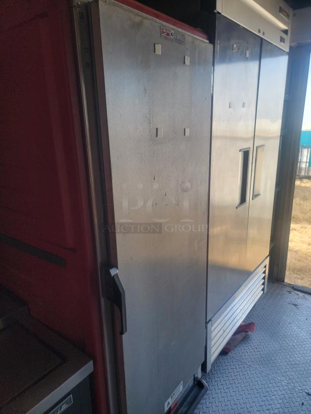 2021 Titanium Cargo 28' mobile kitchen interior showing industrial refrigerator with visible Magic Chef label.