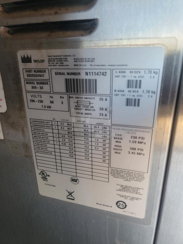 Label on stainless steel equipment, featuring Taylor part number 035933A947, serial number N1114742, voltage 208-230, and NSF certification.
