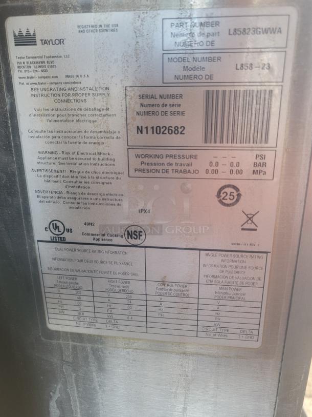 Mobile kitchen equipment label showing Taylor Commercial Foodservice details, model L858-23, serial N1102682, and power specs.