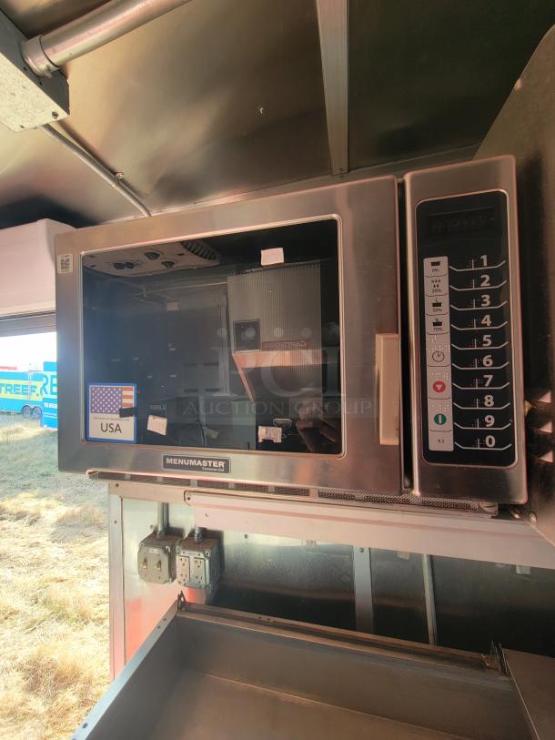 Menumaster commercial oven inside a 2021 Titanium Cargo 28’ mobile kitchen, featuring digital controls and USA sticker.