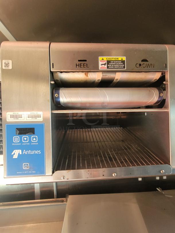 Antunes commercial toaster in the 2021 Titanium Cargo Mobile Kitchen, featuring controls for program, lighter, darker settings.