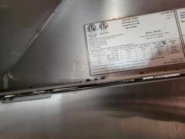 Close-up of a label inside a 2021 Titanium Cargo 28' Mobile Kitchen, showing safety certifications and specifications.