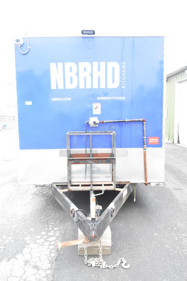 BRAND NEW 2021 Rock Solid Cargo 24' mobile kitchen trailer, blue with NBRHD branding, propane shut-off label visible.