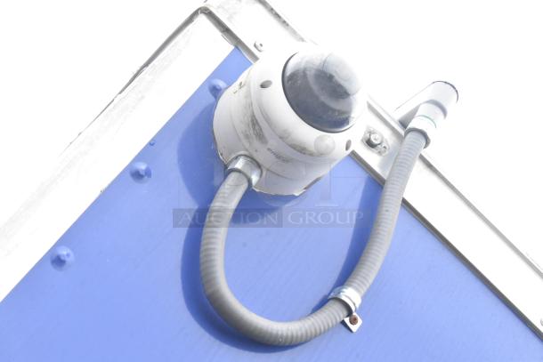 Close-up of a vent and pipe on a blue exterior of the 2021 Rock Solid Cargo fast food trailer.