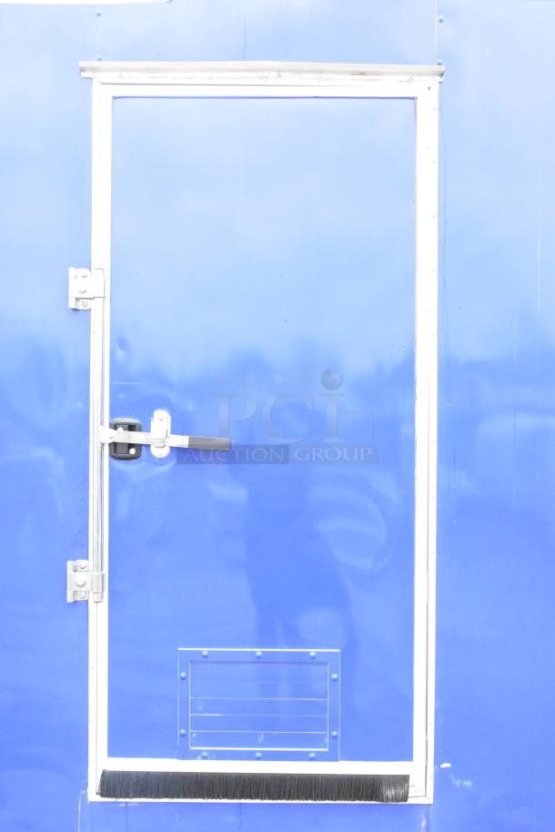 Blue exterior door of a 2021 Rock Solid Cargo 24' fast food trailer. Features secure locking mechanism.