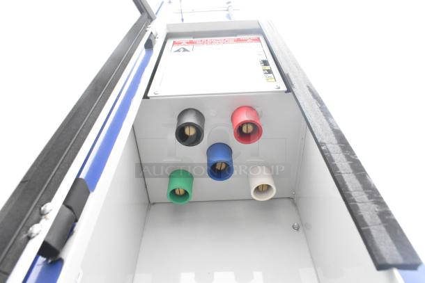 Connections panel inside 2021 Rock Solid Cargo mobile kitchen trailer, showing multi-colored outlets for equipment setup.