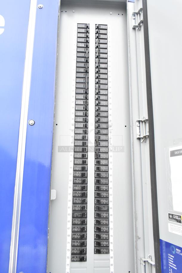 Electrical panel inside a blue 2021 Rock Solid Cargo 24' mobile kitchen trailer.