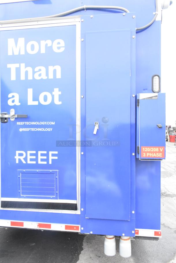 Blue Rock Solid Cargo 24' mobile kitchen trailer, "REEF" branding, side door, 120/208 V 3-phase electrical panel.