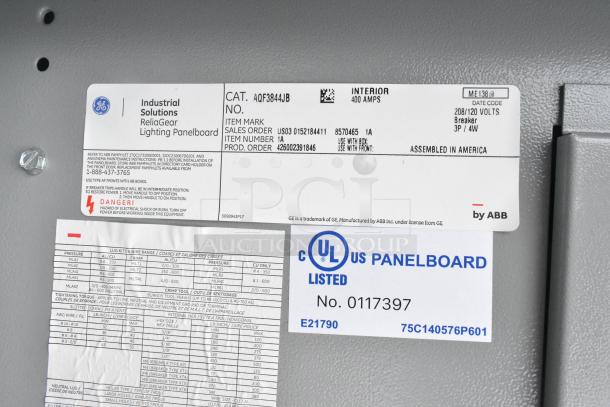 Close-up of ReliaGear lighting panelboard labels by GE, featuring ABB branding, technical specs, and safety warnings.