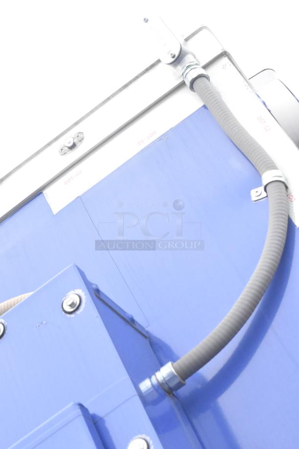 Brand new 2021 Rock Solid Cargo 24' mobile kitchen trailer, fully equipped for fast food service. Blue exterior with hoses visible.