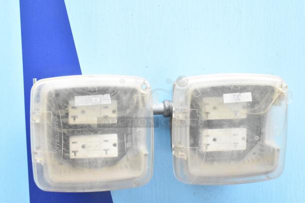 Protective outlet covers with "Intermatic" branding, attached side by side. Numbers "39" and "40" are visible on labels.