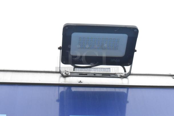 Outdoor light fixture, 50W, IP66 rating, mounted on a trailer.