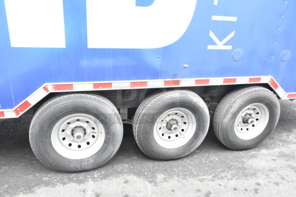 2021 Rock Solid Cargo 24' mobile kitchen trailer, brand new, blue exterior, triple axle, outfitted for fast food service.