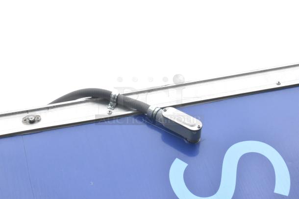 Close-up of a metallic conduit box and cable on a blue surface, part of the 2021 Rock Solid Cargo trailer.
