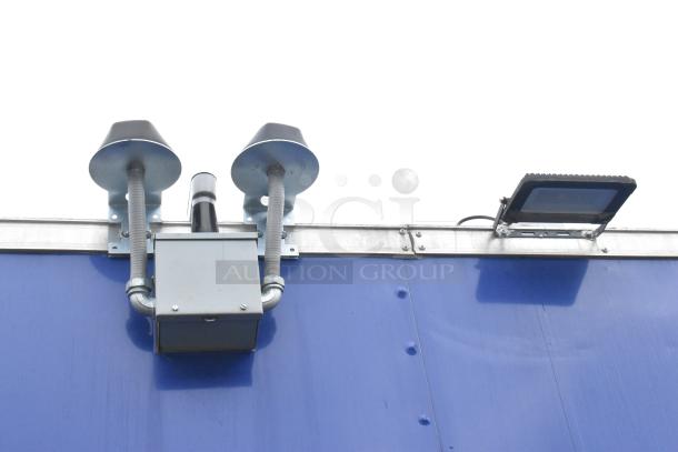 24' Rock Solid Cargo fast food trailer, brand new, blue exterior, equipped with ventilation and lighting fixtures.