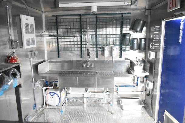 Brand new 2021 Rock Solid Cargo 24' mobile kitchen trailer with stainless steel sink, commercial equipment, and storage.