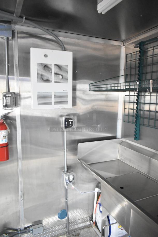 Rock Solid Cargo 24' mobile kitchen, brand new, with CaptiveAire grease hood, stainless steel sink, and shelving, fully equipped.