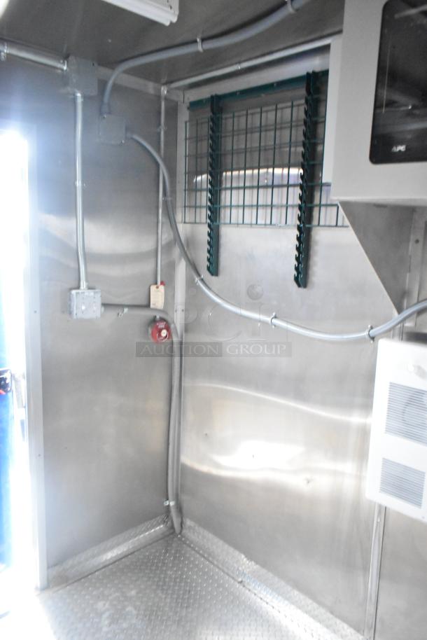 Brand new 2021 Rock Solid Cargo 24' fast food trailer interior. Stainless steel walls, commercial wiring, APC panel.