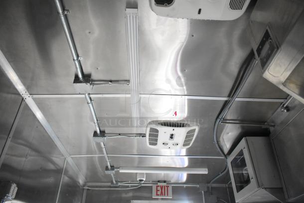 Interior ceiling view of the 2021 Rock Solid Cargo 24' fast food trailer. Visible wiring, fixtures, and ventilation are shown.