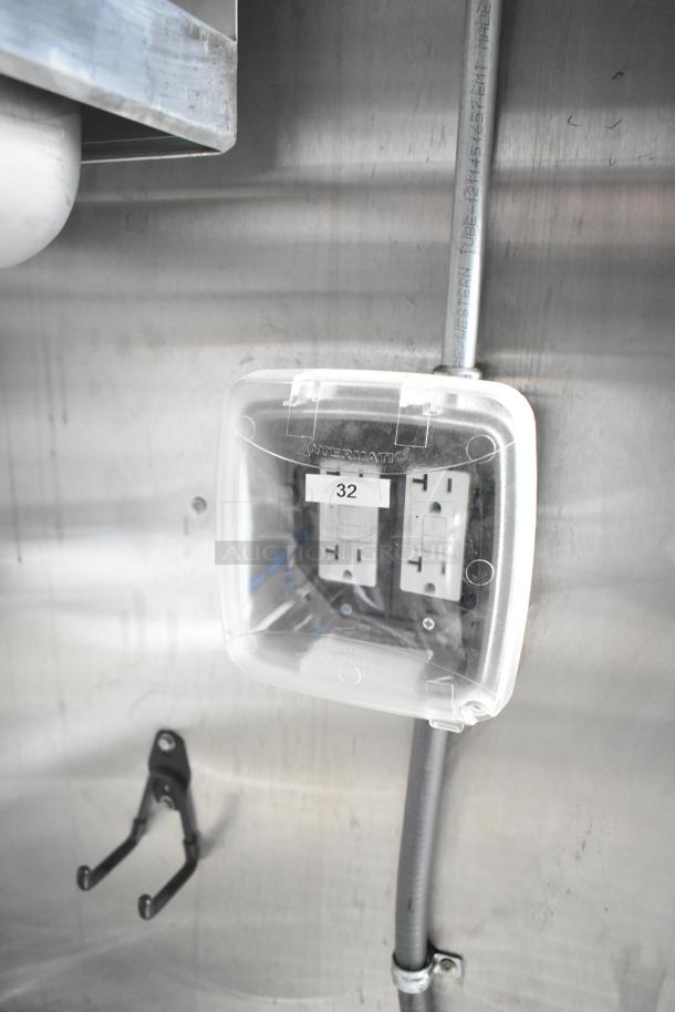 Electrical outlet in a brand new 2021 Rock Solid Cargo mobile kitchen trailer, protected by a clear Intermatic cover.