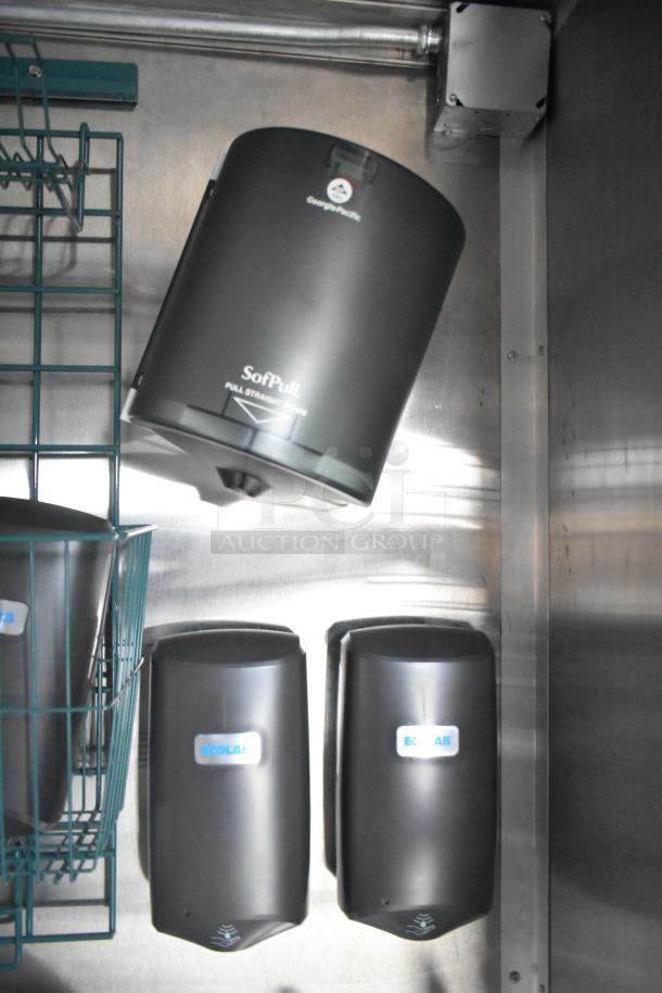 Interior of a 2021 Rock Solid Cargo 24' mobile kitchen trailer featuring Ecolab soap dispensers and a SofPull paper towel dispenser.