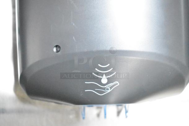 Touchless automatic soap dispenser in a mobile kitchen. Features sensor and droplet icon.